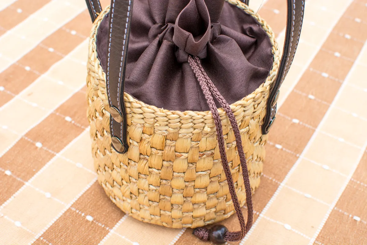 straw bucket bag with leather handle