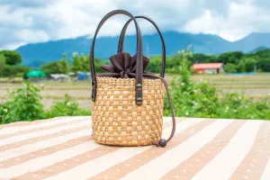 straw bucket bag with leather handle